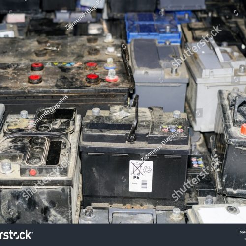 stock-photo-pallet-with-used-car-batteries-waiting-to-be-recycled-in-an-environmentally-harmful-scrap-yard-2064923765