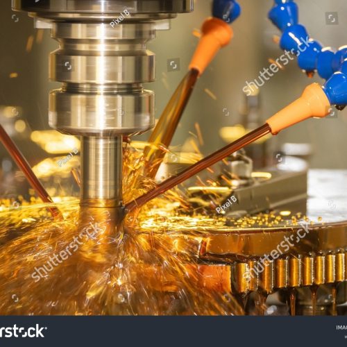 stock-photo-the-cnc-milling-machine-cutting-the-mold-parts-with-oil-coolant-method-the-mold-and-die-2247205667